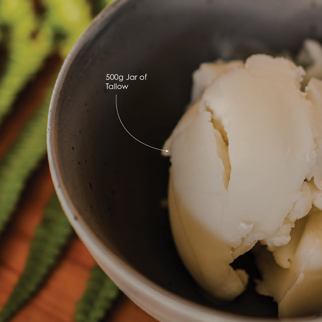 Bowl with a scoop of Tallow and text '500g Jar of Tallow' on a colorful background