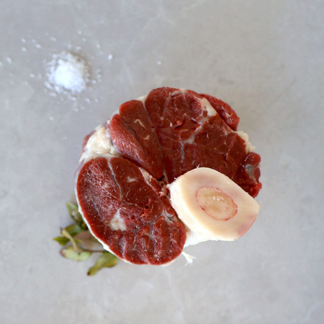 Bone - in wagyu shank or Thors hammer on benchtop
